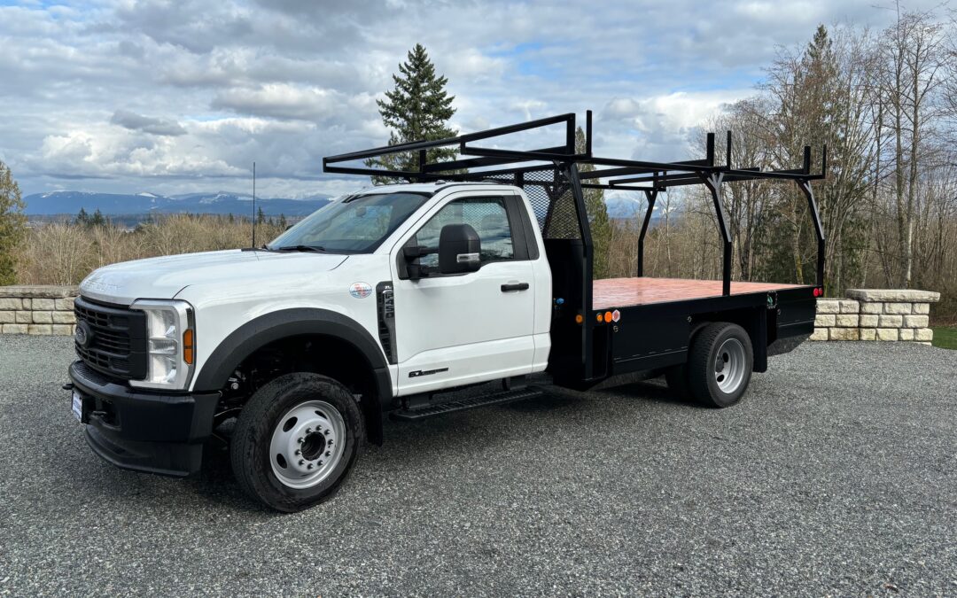 Custom flatbed with forkliftable rack and side boxes for Edge Concrete