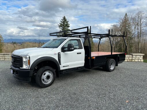 Custom flatbed with forkliftable rack and side boxes for Edge Concrete